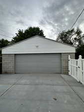 Detached garage featuring a gate