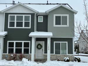 View of front of house featuring stone siding