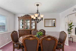 Formal dining room with window looking into the backyard.