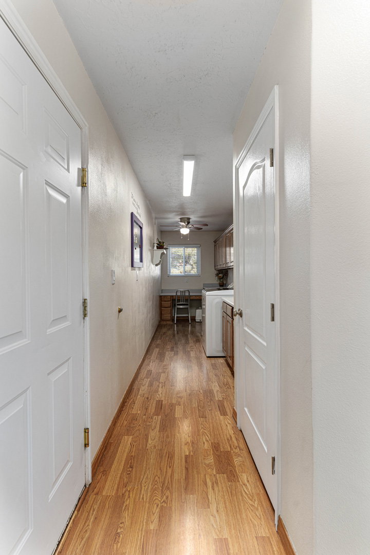 Hallway to laundry room. The door on the left leads to the garage.