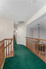 Upstairs landing looking toward primary bedroom. In the opposite direction there are an additional 3 bedrooms and full bathroom.