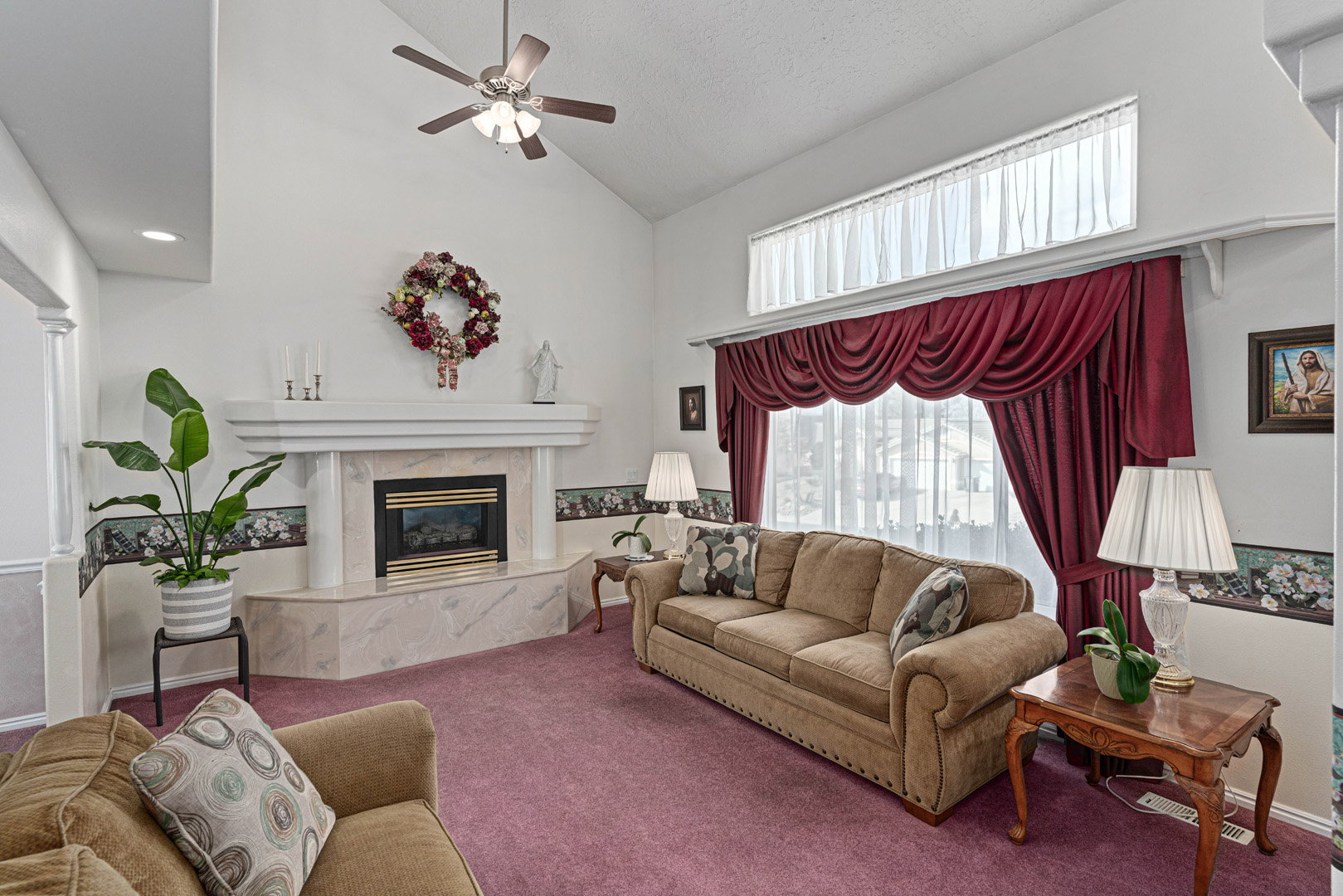 Large and open formal living room with fireplace.