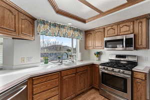 Kitchen with views into the backyard/pool area from the bay window.