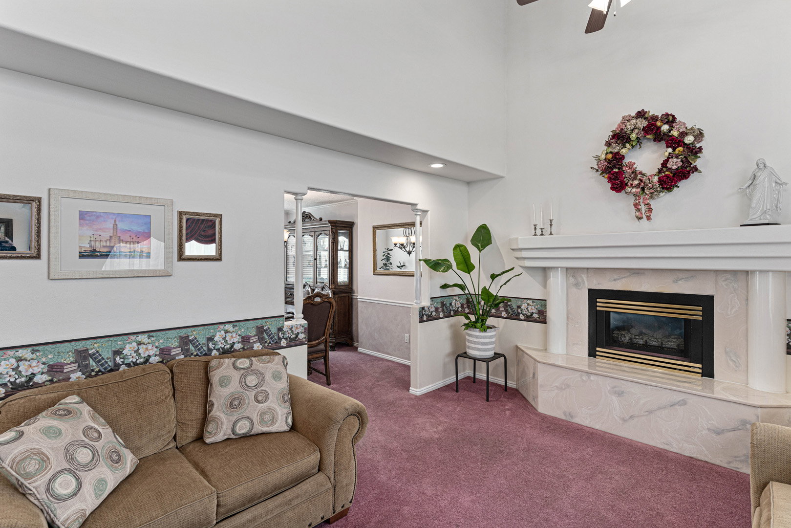 Large and open formal living room connects to the formal dining room.