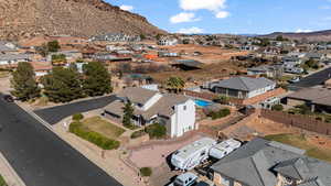 Aerial perspective of neighborhood area featuring a mountainous background