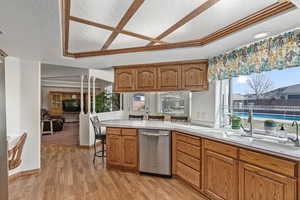 Kitchen and dining nook area that also connects to a large family/tv room with vaulted ceilings.
