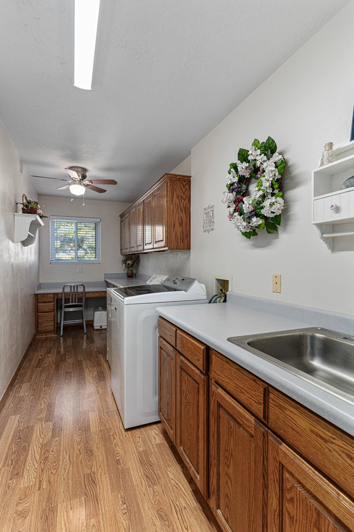 Laundry room with sink and desk/craft area.