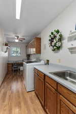 Laundry room with sink and desk/craft area.