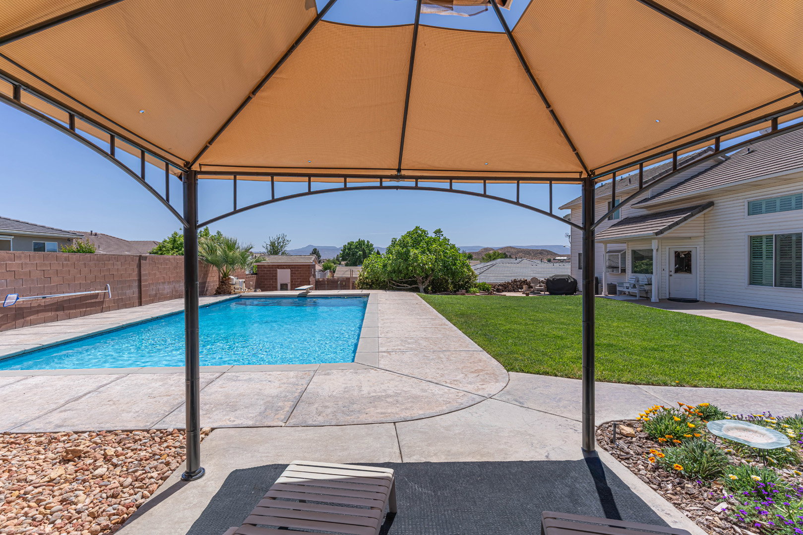 View of swimming pool under gazebo.