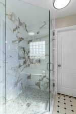 Brand new glass and tile enclosed primary shower.