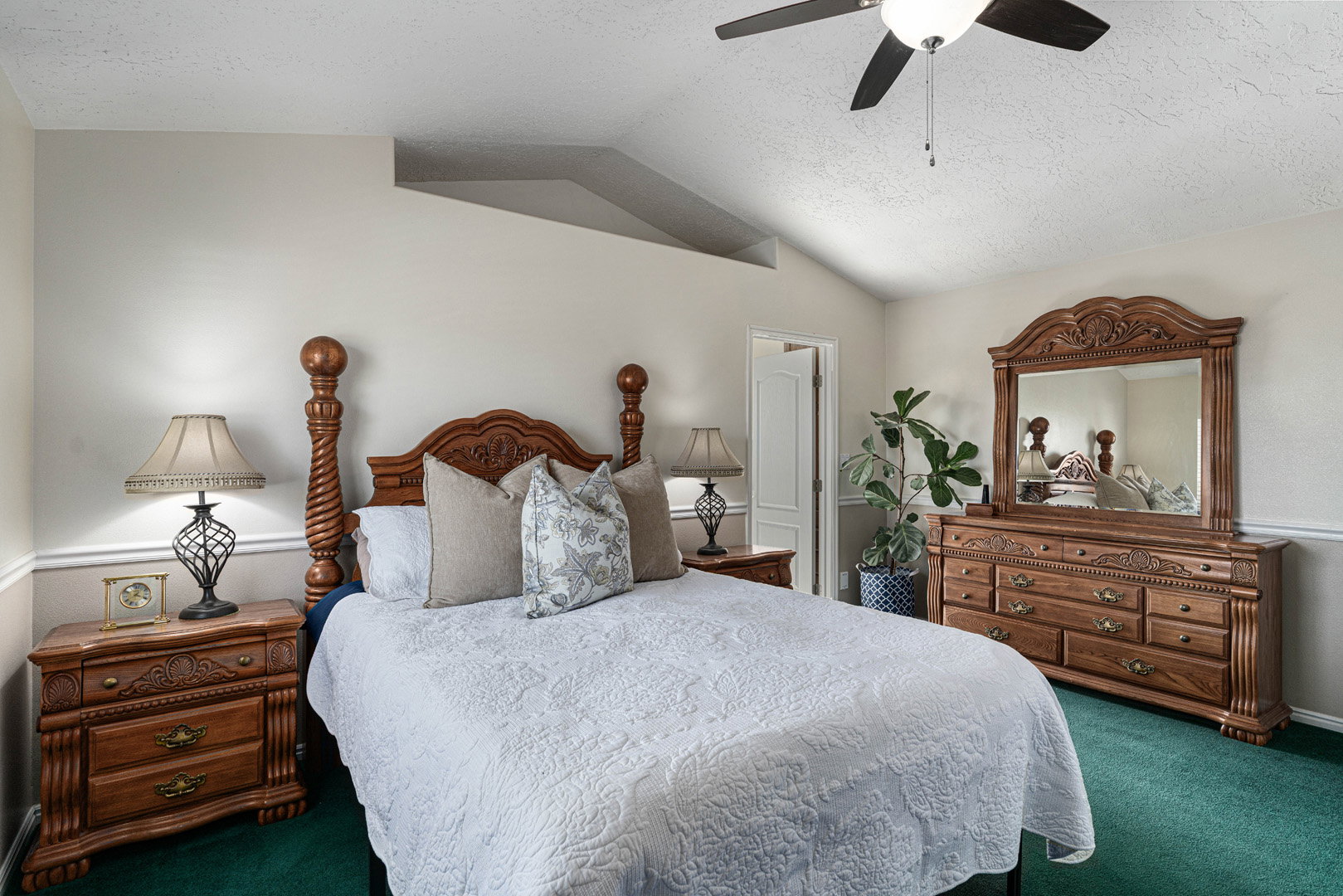 Large primary bedroom with a door to the primary bathroom and closet.