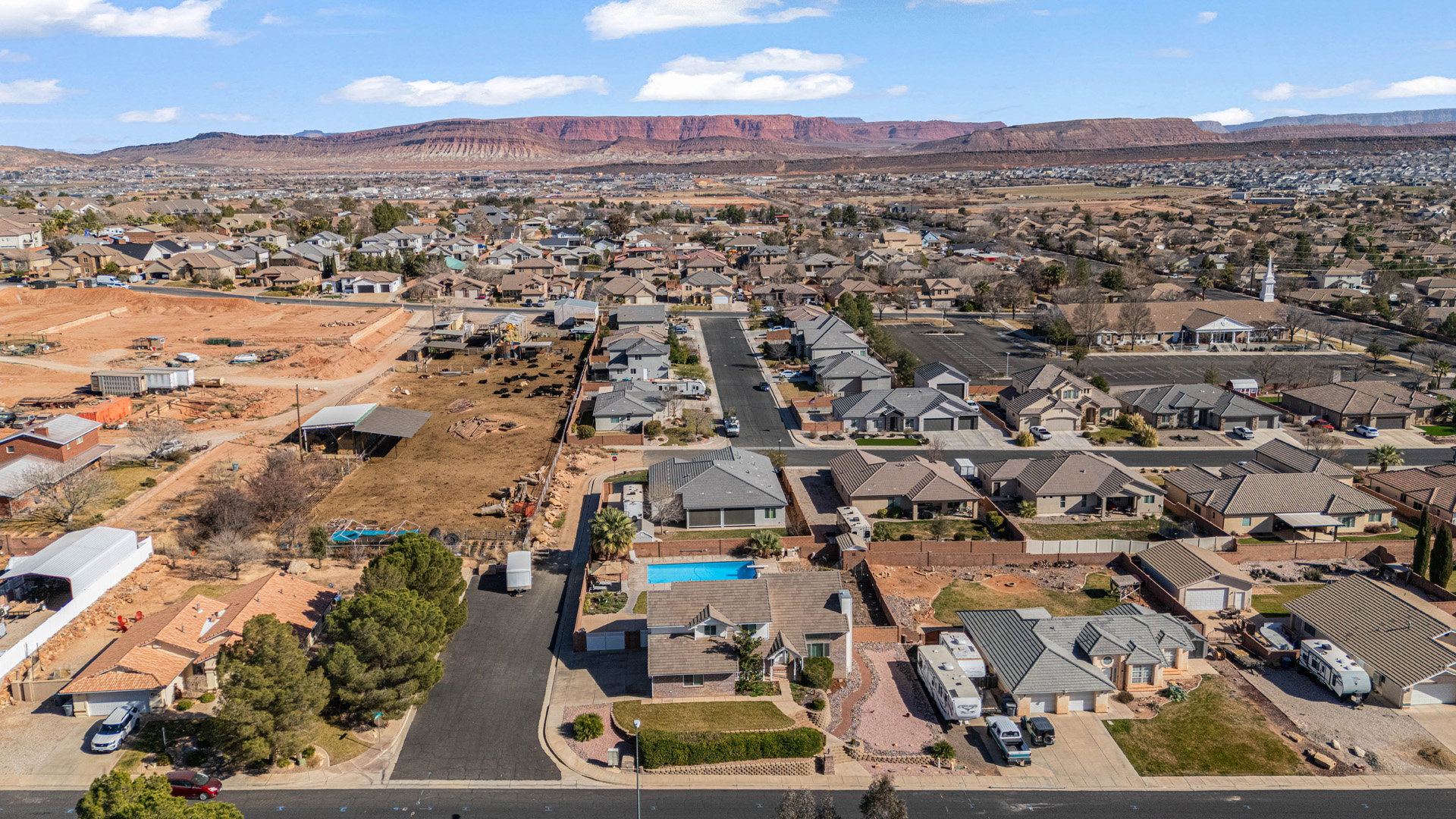 Aerial perspective of neighborhood featuring a mountainous background