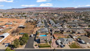 Aerial perspective of neighborhood featuring a mountainous background