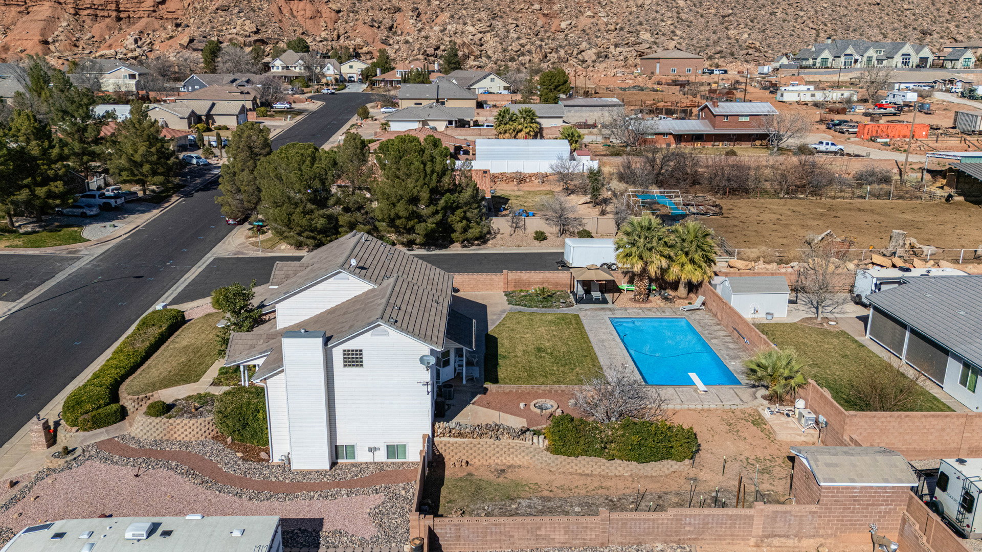 Aerial view of residential area featuring the large backyard and pool