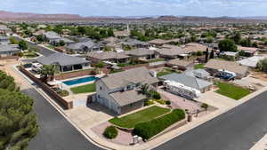 Aerial view of residential area with mountains and a pool area
