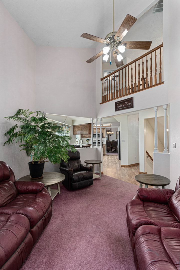 Looking back toward kitchen and upstairs landing.