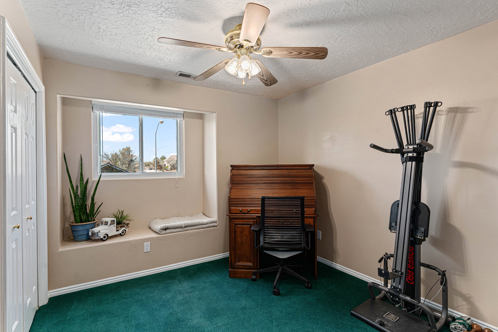 Large bedroom with window facing west.