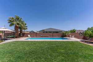 View of pool with patio surround, a fenced backyard, and a gazebo