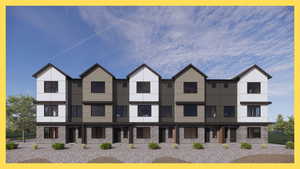 Contemporary house featuring brick siding and stucco siding