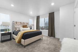 Bedroom featuring light colored carpet and recessed lighting