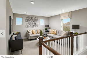 Carpeted living room featuring baseboards