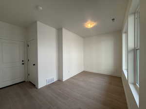 Front door enters into open flex space with large windows