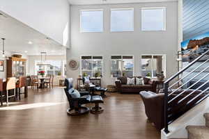 Living room with hardwood / wood-style flooring and recessed lighting