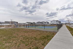 View of pickleball courts featuring a residential view