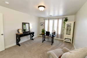 Office area with light colored carpet