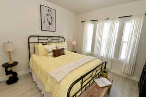 Bedroom with light wood-style floors