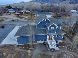 Aerial perspective of suburban area featuring a mountainous background