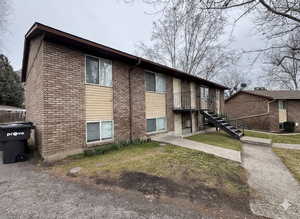 View of apartment building / complex featuring stairway