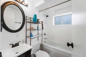 Full bathroom with vanity and shower / tub combination