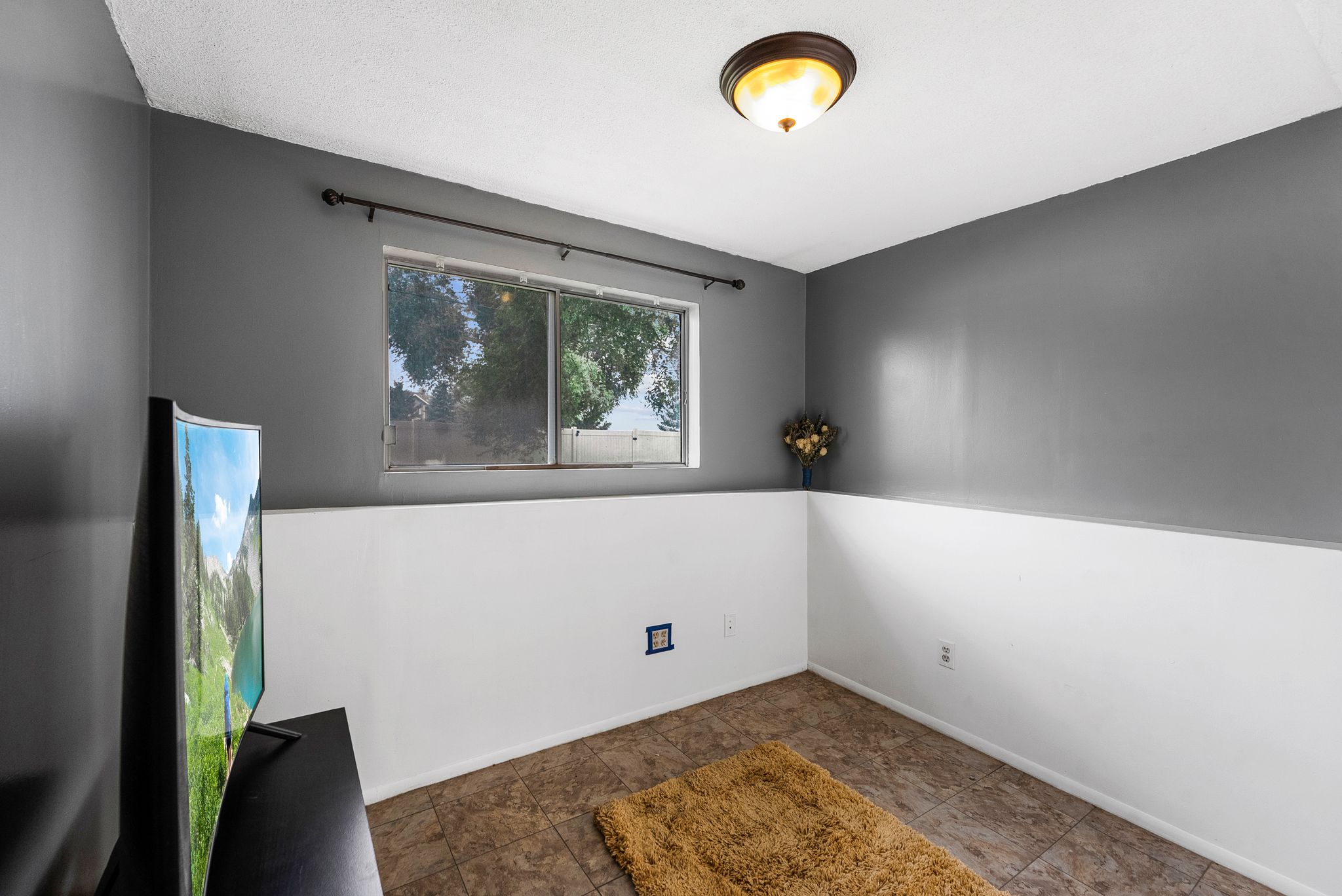 Spare room featuring baseboards