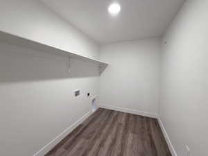Laundry room featuring light wood-style floors, hookup for an electric dryer, and hookup for a washing machine