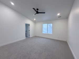 Unfurnished room with carpet floors, ceiling fan, lofted ceiling, and recessed lighting