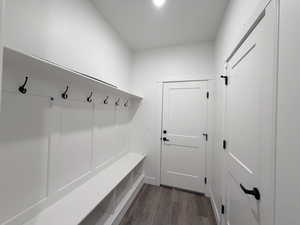Mudroom with dark wood finished floors