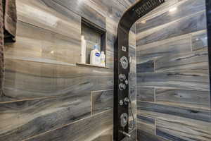 Bathroom view of a tile shower
