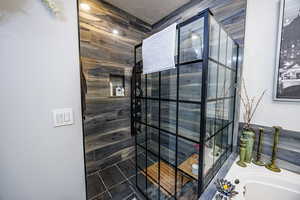 Full bathroom featuring a walk in shower and a garden tub