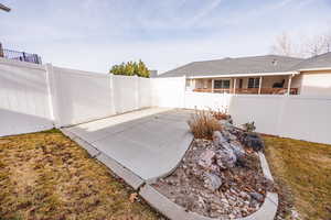 Fenced backyard featuring a patio area