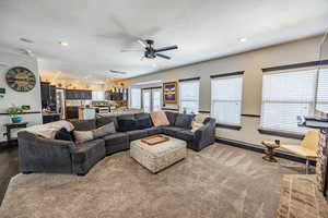 Living room with ceiling fan and recessed lighting