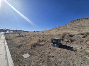 View of mountain backdrop with rural landscape