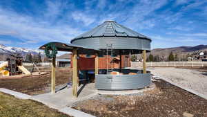 View of outdoor structure featuring a gazebo and a mountain view