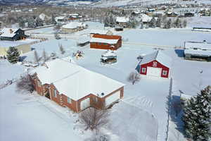 Snowy aerial view with a residential view