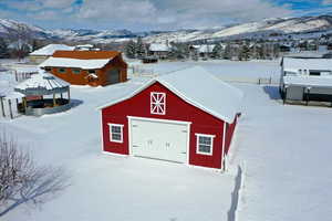 Snow covered structure with a mountain view