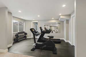Exercise room featuring recessed lighting