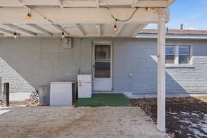 Back of the Property entrance with brick siding
