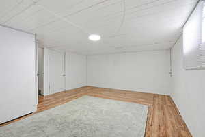 Finished below grade area featuring light wood-style floors