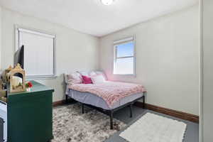 Bedroom featuring baseboards