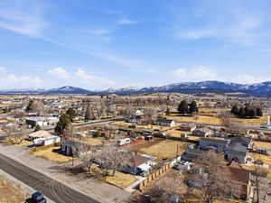 View of mountain backdrop with nearby suburban area